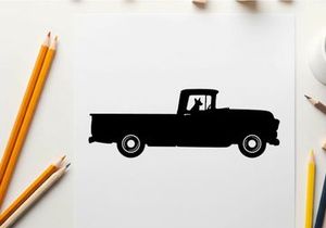 Silhouette of a classic pickup truck with a dog