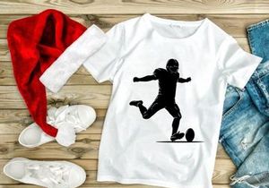 American football player kicking a ball in action silhouette