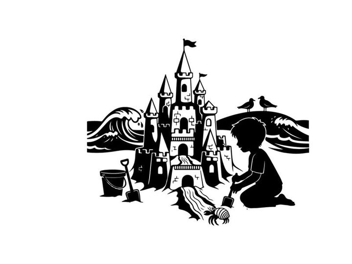 Silhouette of child building sandcastle on beach by sea