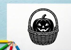 Halloween Pumpkin with Carved Face in Wicker Basket for Fall Decor