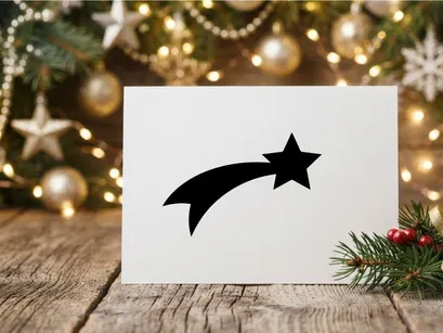 Schwarzes Sternschnuppen-Symbol isoliert auf weißem Hintergrund für Weihnachtselemente.