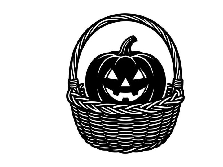 Halloween Pumpkin with Carved Face in Wicker Basket for Fall Decor