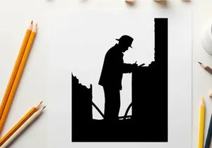 Silhouette of a man working on a construction site at night