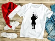 Silhouette of Bagpiper in Kilt