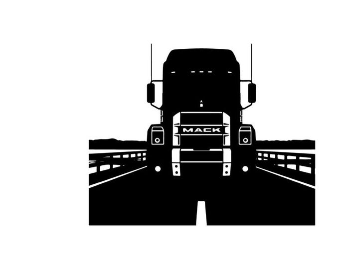 Silhouette of a mack truck on a bridge