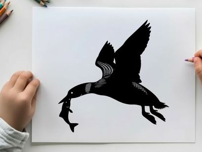 Silhouette of a bird in flight with prey