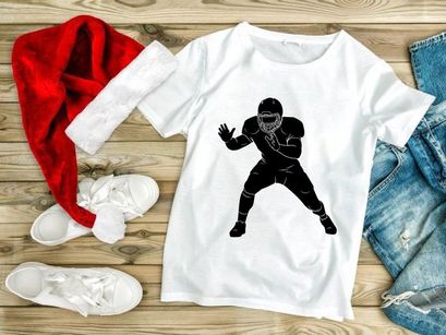 American football player in action wearing protective gear and uniform