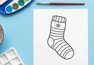Cozy Christmas sock with snowflake pattern isolated on white background for festive holiday decor