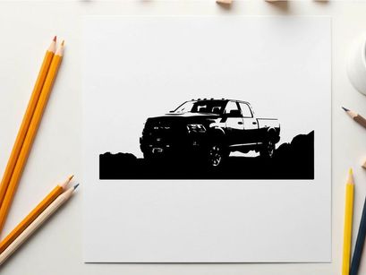 Silhouette of a pickup truck in a rugged outdoor setting silhouette