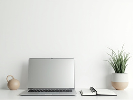 Minimal desk workspace with laptop, notebook, and indoor plant preview picture