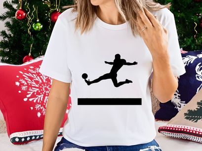 Silhouette of a soccer player kicking a ball in mid air dynamically