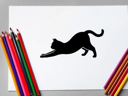 Silhouette of a playful black cat stretching on white background
