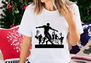 Silhouette of soccer player kicking ball with stadium lights on