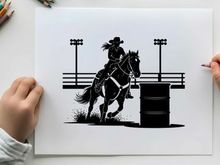 Cowboy riding horse silhouette in rodeo arena