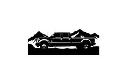 Black silhouette pickup truck in front of mountain range silhouette