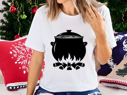 Black cauldron boiling over campfire minimalist vector icon