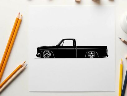 Silhouette of a classic lowered pickup truck with large wheels