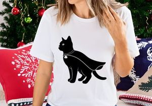 Black cat in cape and shamrock charm