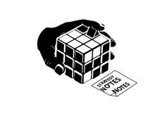 Hand holding a rubik's cube with strategy notes silhouette