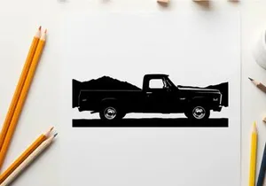Silhouette of a pickup truck against a mountain range silhouette