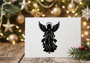 Black angel silhouette with wings and halo for spiritual or holiday themes