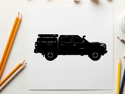 Silhouette of a pickup truck with a camper on the back