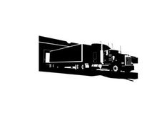 Silhouette of a large semi truck with trailer