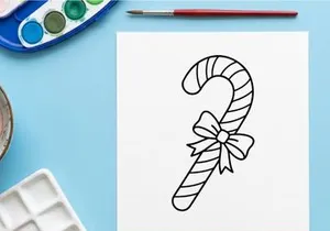 Hand-drawn candy cane with festive bow for Christmas holiday celebration decor