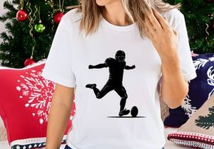 American football player kicking a ball in action silhouette
