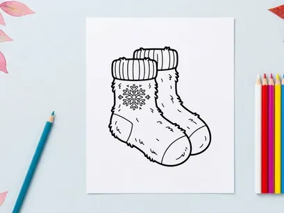 Hand-drawn white knitted Christmas baby booties with snowflake embroidery on toes
