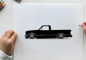 Silhouette of a classic lowered pickup truck in black