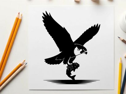 Silhouette of a bird of prey swooping down to catch a fish