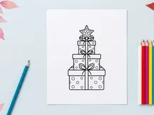 Stacked Christmas gift boxes with bows and star topper for holiday celebration