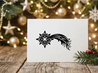 Black and white Christmas star icon with a flowing comet tail design element.