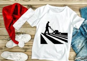 Man silhouette mowing lawn on sunny day with mower
