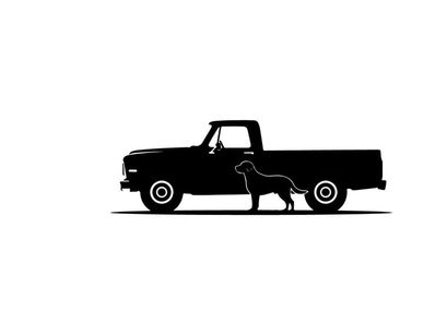 Silhouette of a dog standing beside a classic pickup truck