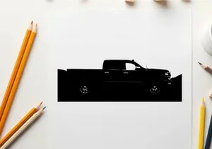 Silhouette of a pickup truck against a mountainous landscape