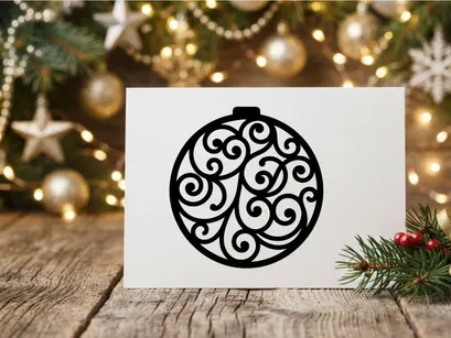Black Christmas bauble silhouette with intricate swirl pattern isolated on white background