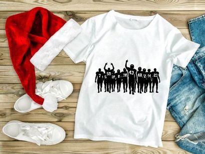 American football team silhouettes with raised arms in victory or celebration