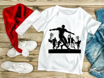 Silhouette of soccer player kicking ball with stadium lights on preview picture