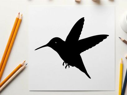 Silhouette of a hummingbird in flight against a white background