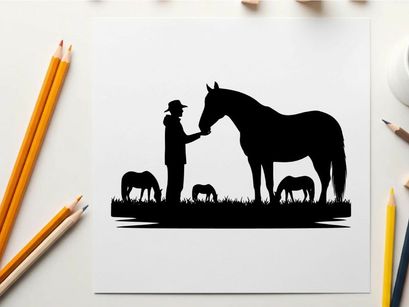 Silhouette of man petting horse with foals grazing nearby