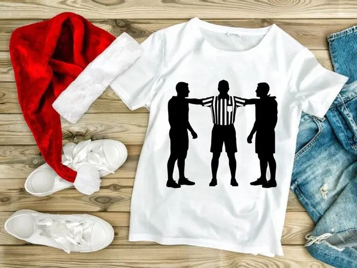 Referee separating two players in a sports conflict
