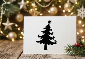 Black silhouette of a Christmas tree with a star topper on a white background