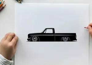 Silhouette of a classic lowered pickup truck with large wheels