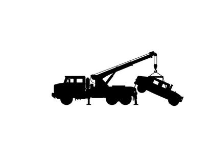 Silhouette of a tow truck lifting a car with a crane