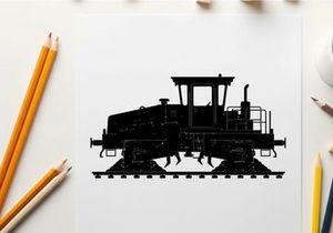 Silhouette of a caterpillar tractor on railroad tracks