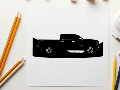 Silhouette of a pickup truck against a mountain range silhouette