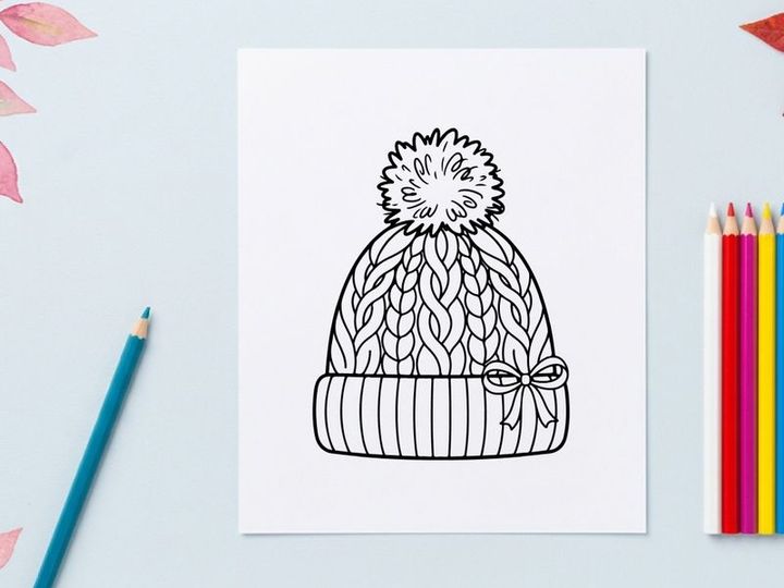 Winter knit beanie hat with pom pom and bow, black and white line art illustration.