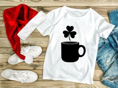 Mug of coffee with a shamrock leaf